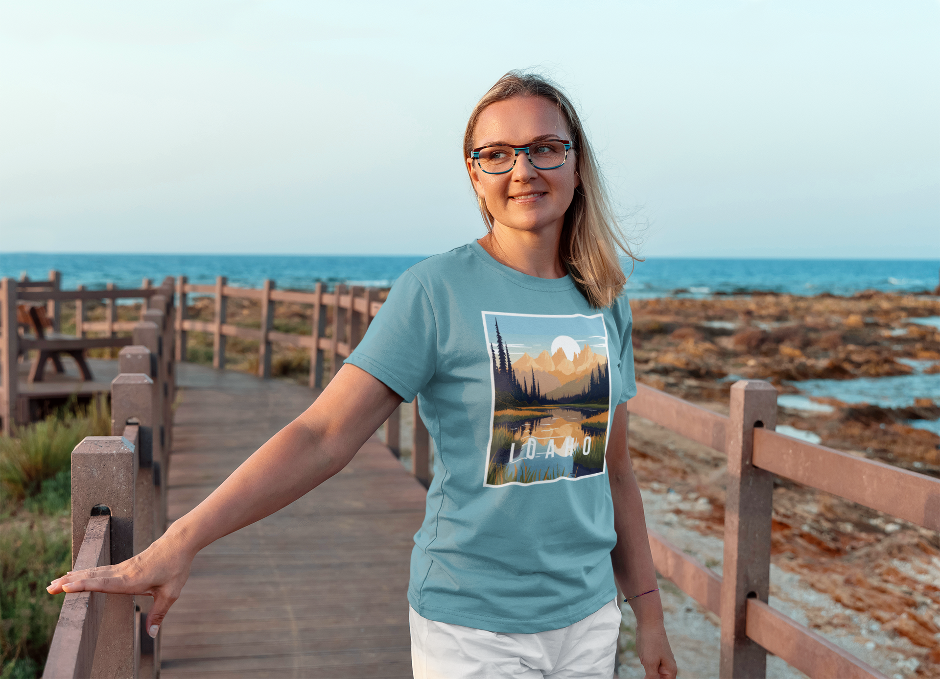 t-shirt-mockup-of-a-woman-with-glasses-standing-on-a-bridge-by-the-beach-m16523-r-el2_1_b7687d79-7b18-498e-b47c-f1a1bbd98230.png